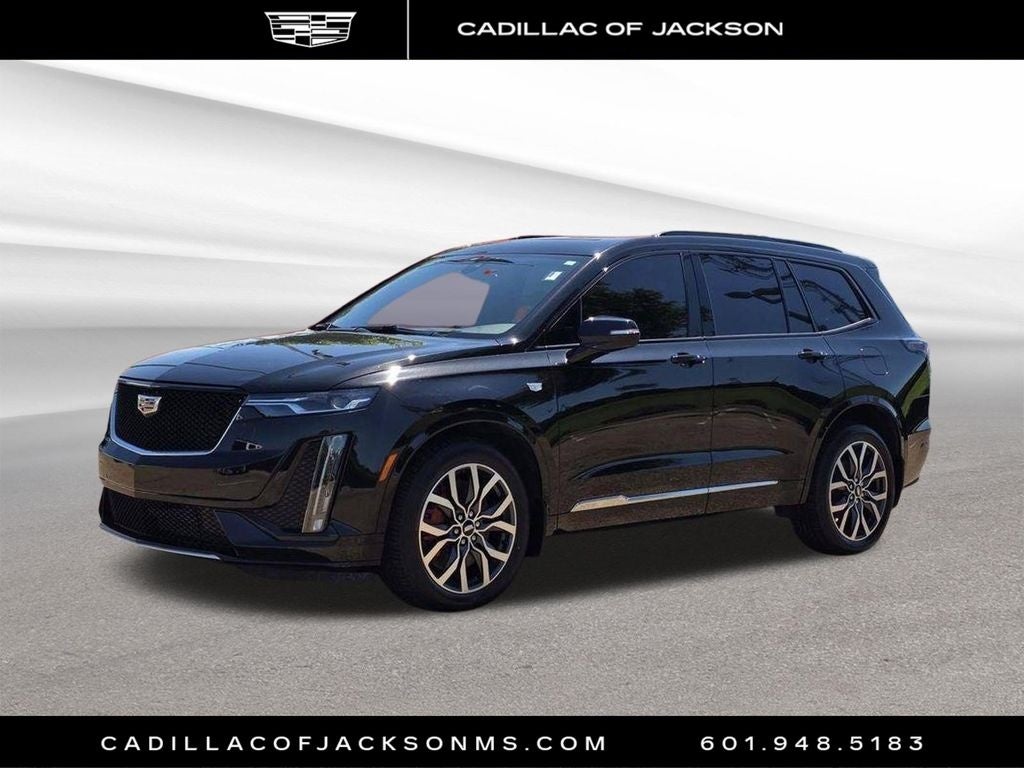 2024 Cadillac XT6 Sport in Stellar Black Metallic — front three-quarter view