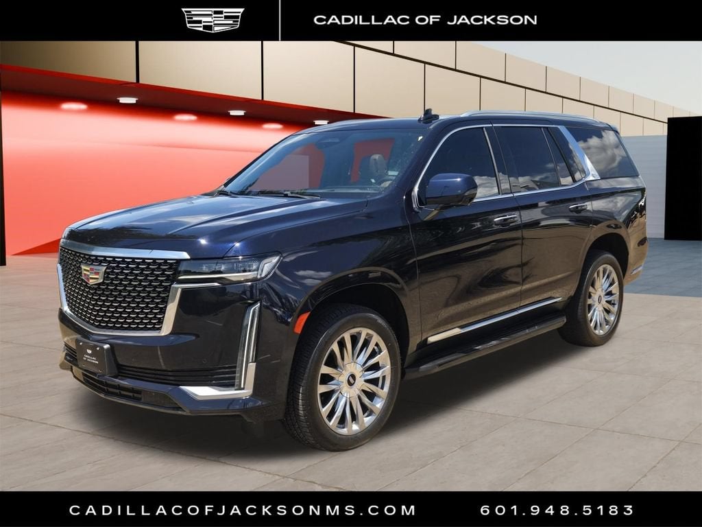 2023 Cadillac Escalade Premium Luxury in Dark Moon Blue Metallic — front three-quarter view